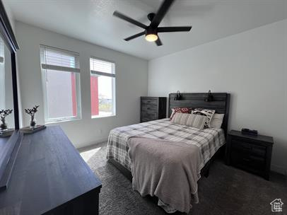 Carpeted bedroom with ceiling fan