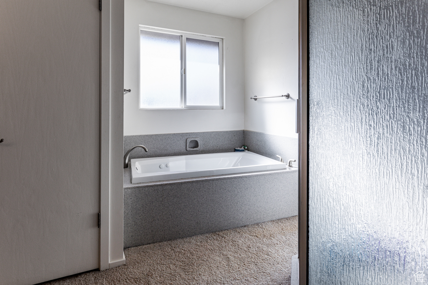 Bathroom featuring tiled tub