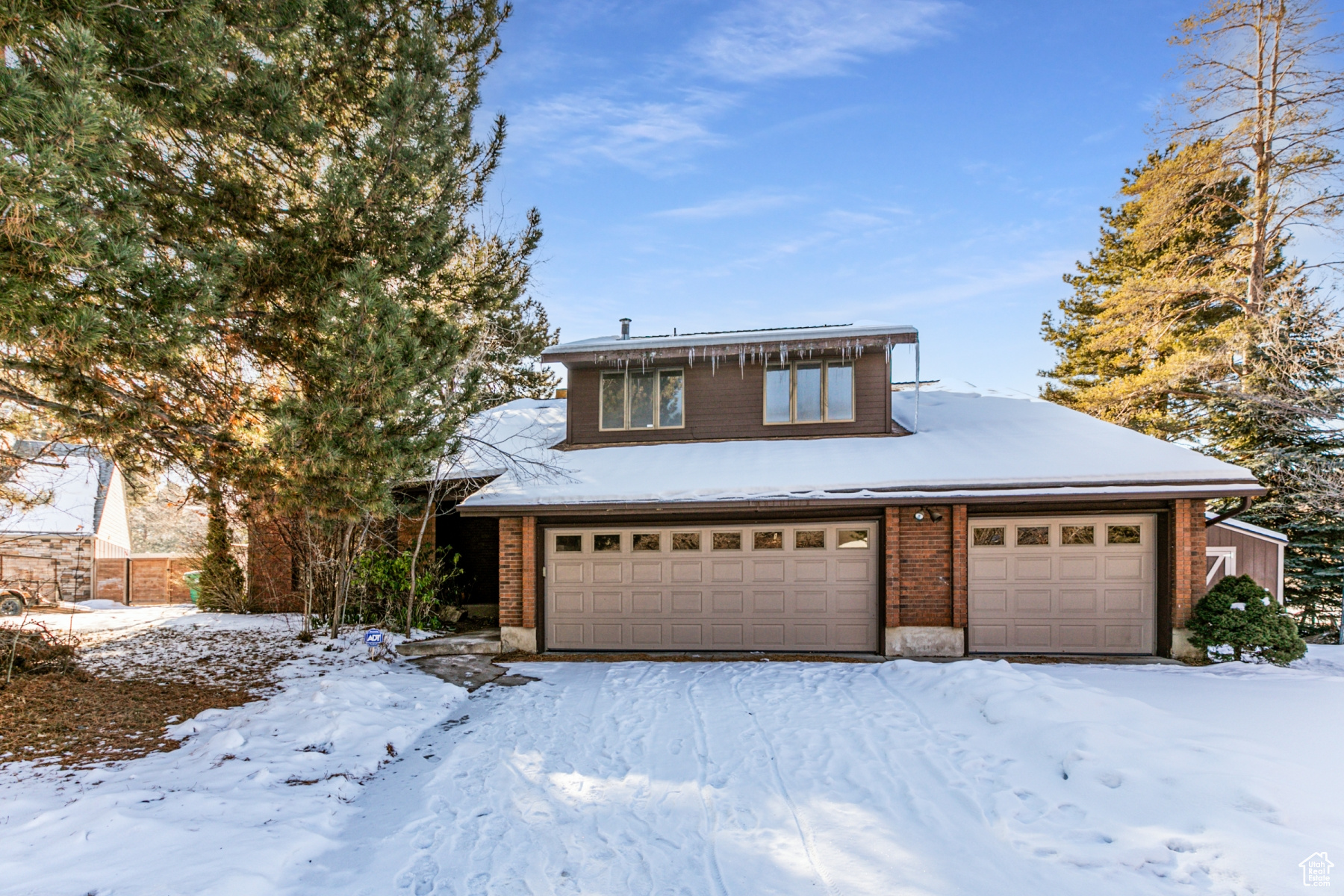 View of property with a garage