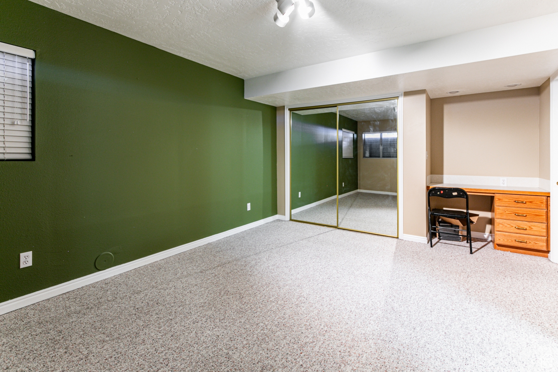 Unfurnished bedroom featuring a closet and a textured ceiling