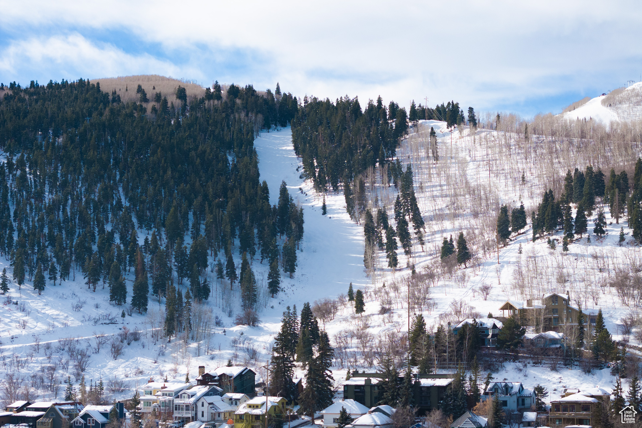 Snowy aerial view with a mountain view