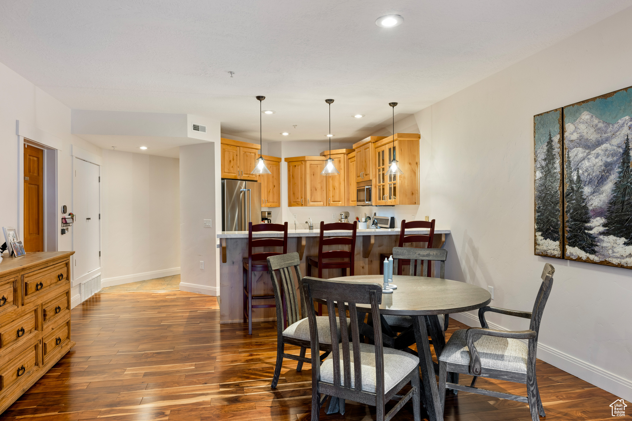 Dining room with dark wood-type flooring