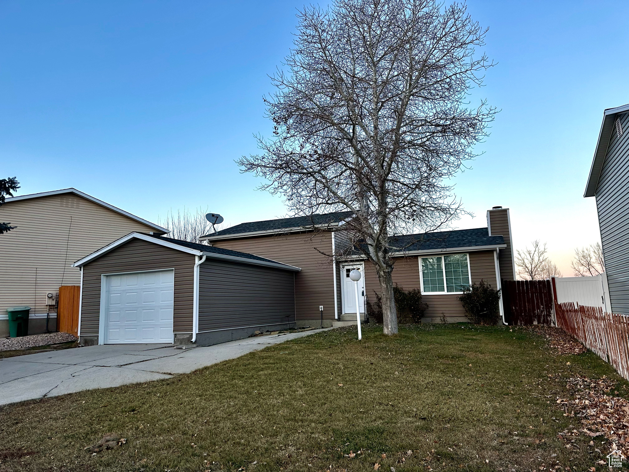 New vinyl siding and attached garage