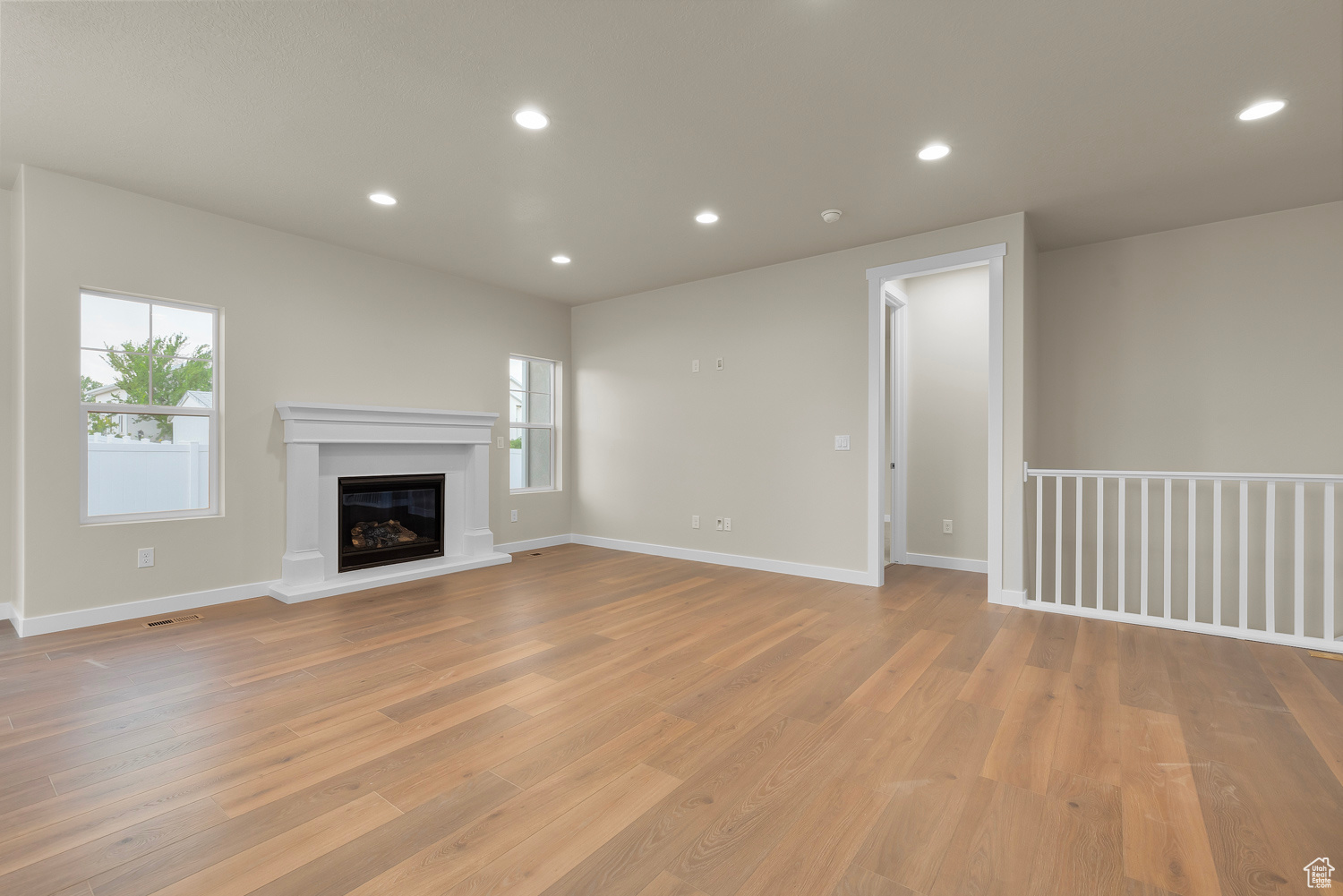 Unfurnished living room with light hardwood / wood-style flooring