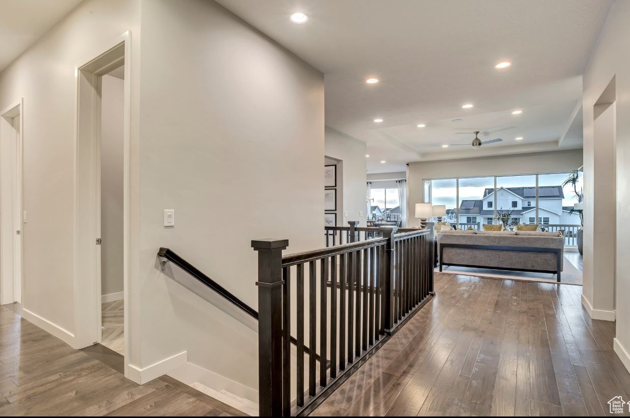 Stairway with hardwood / wood-style floors