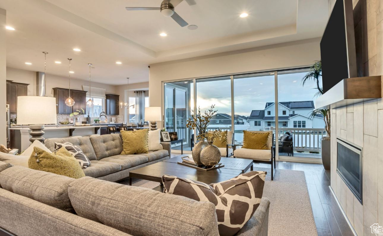 Living room featuring hardwood / wood-style flooring, a tile fireplace