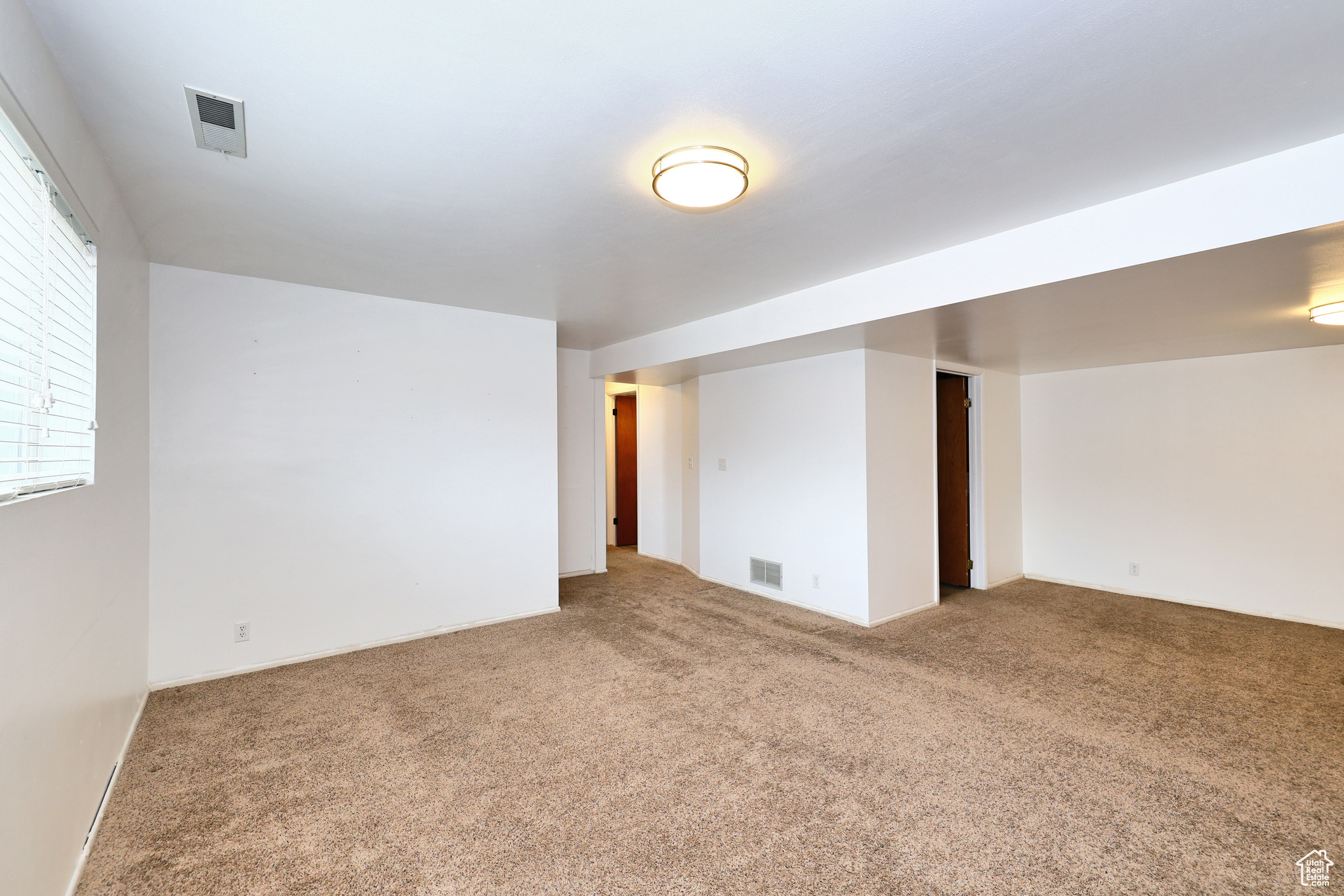 Basement featuring carpet