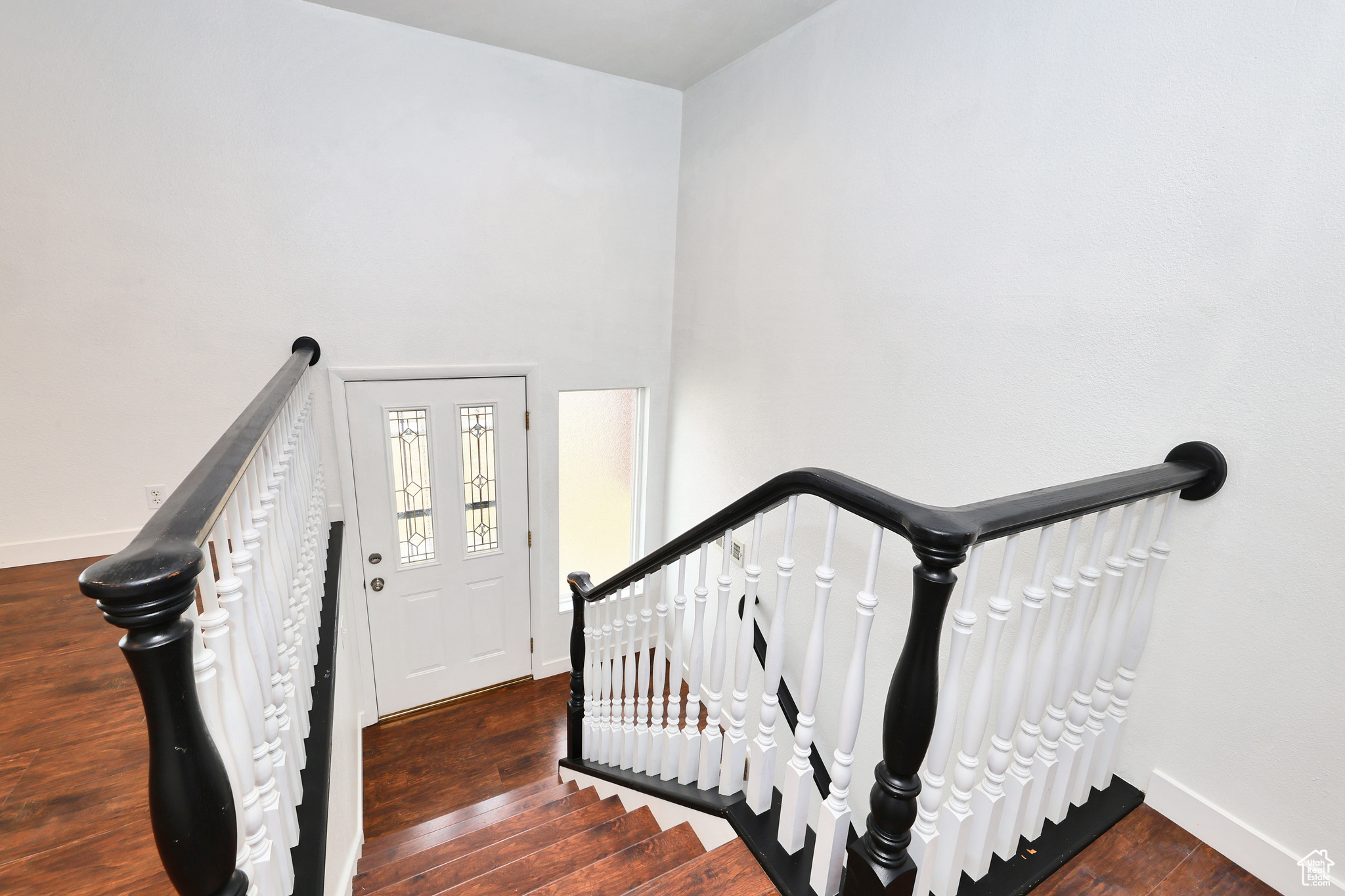 Stairway featuring wood-type flooring