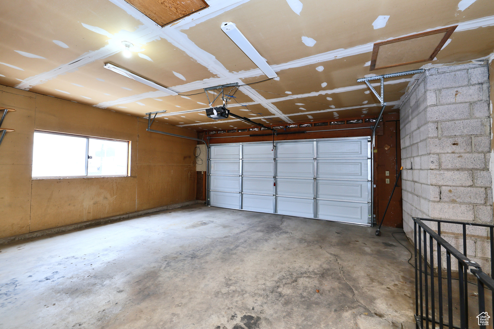 Garage featuring a garage door opener