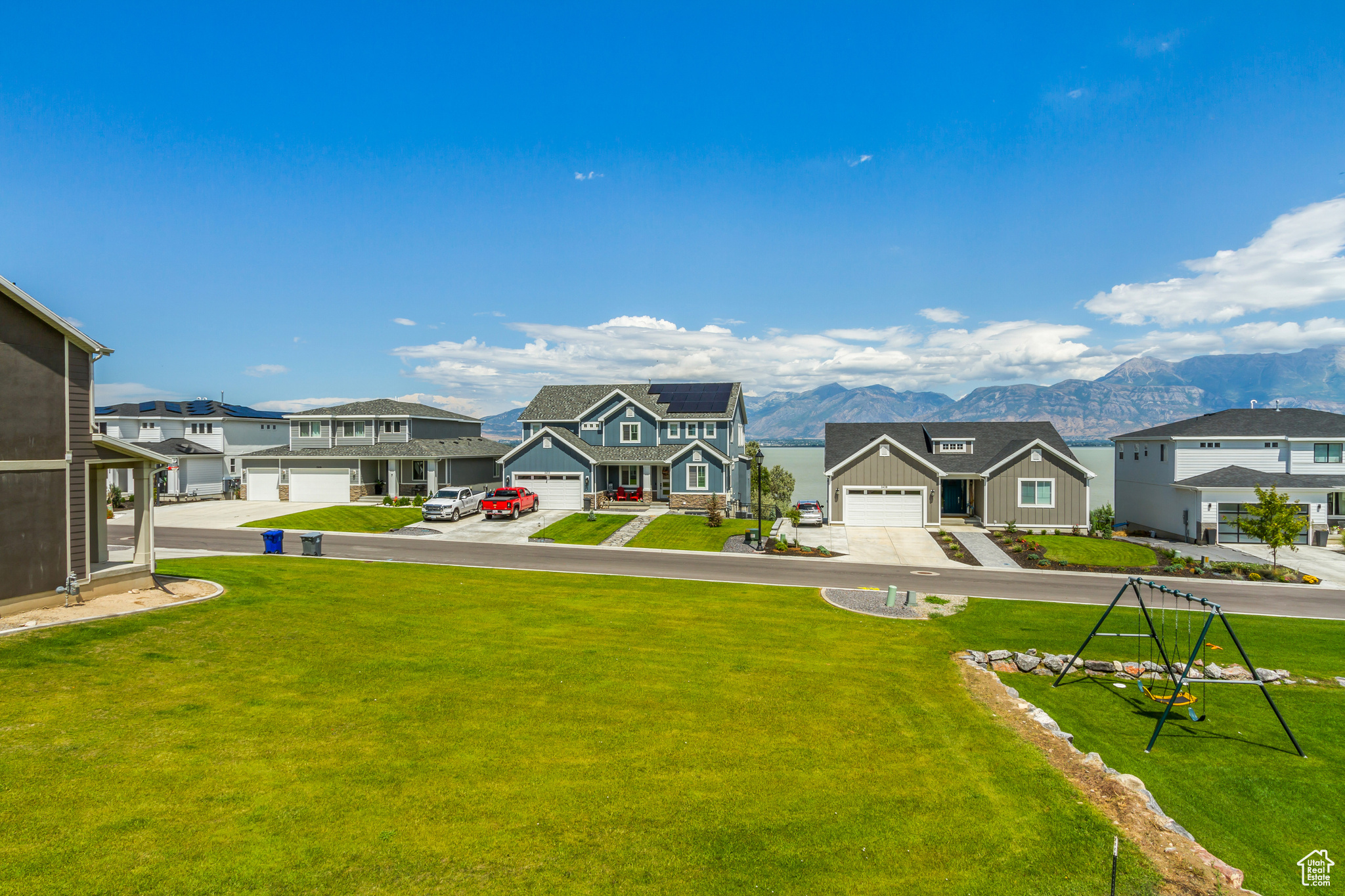 Exterior space with a garage and a mountain view