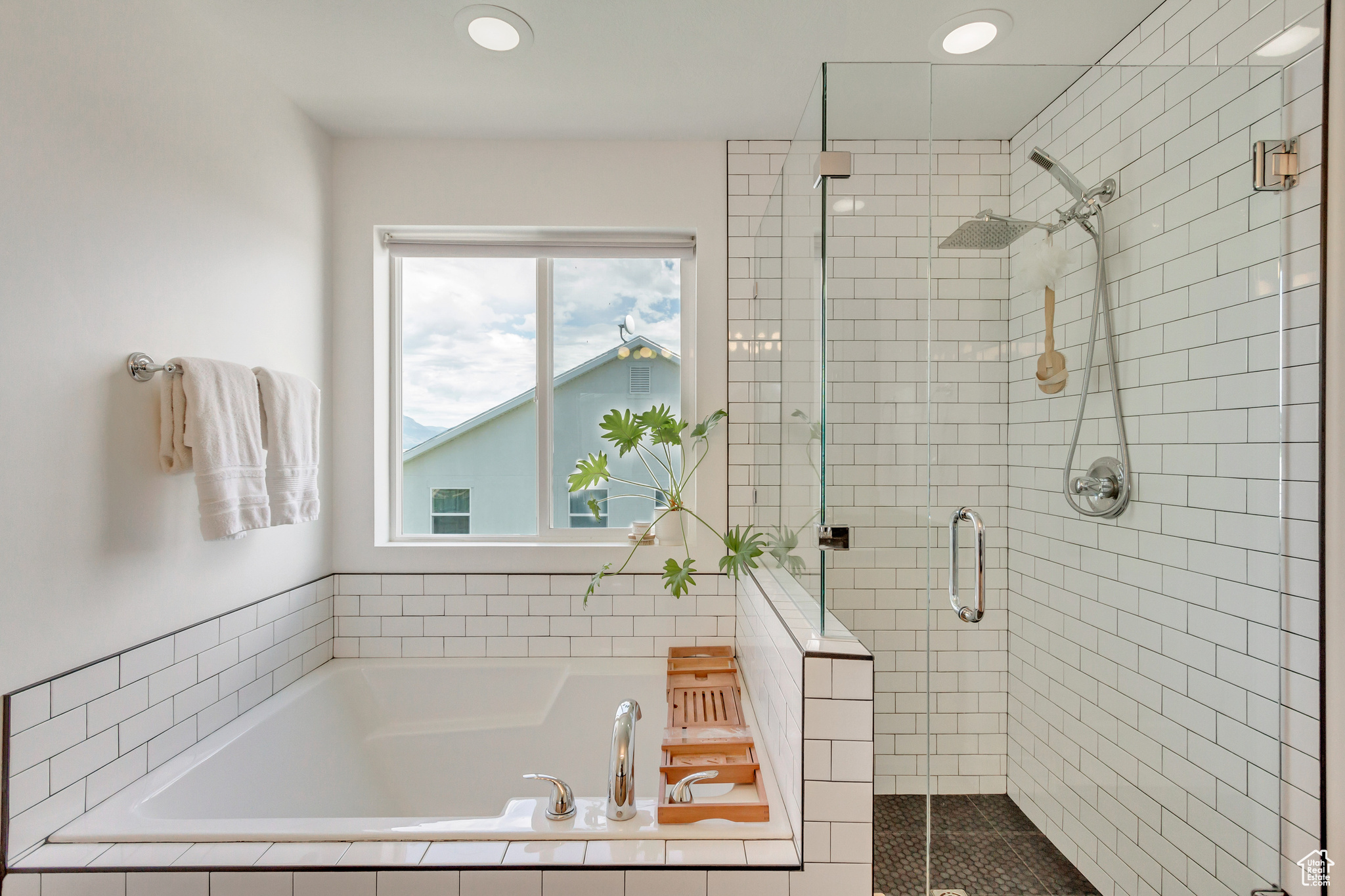 Bathroom featuring separate shower and tub