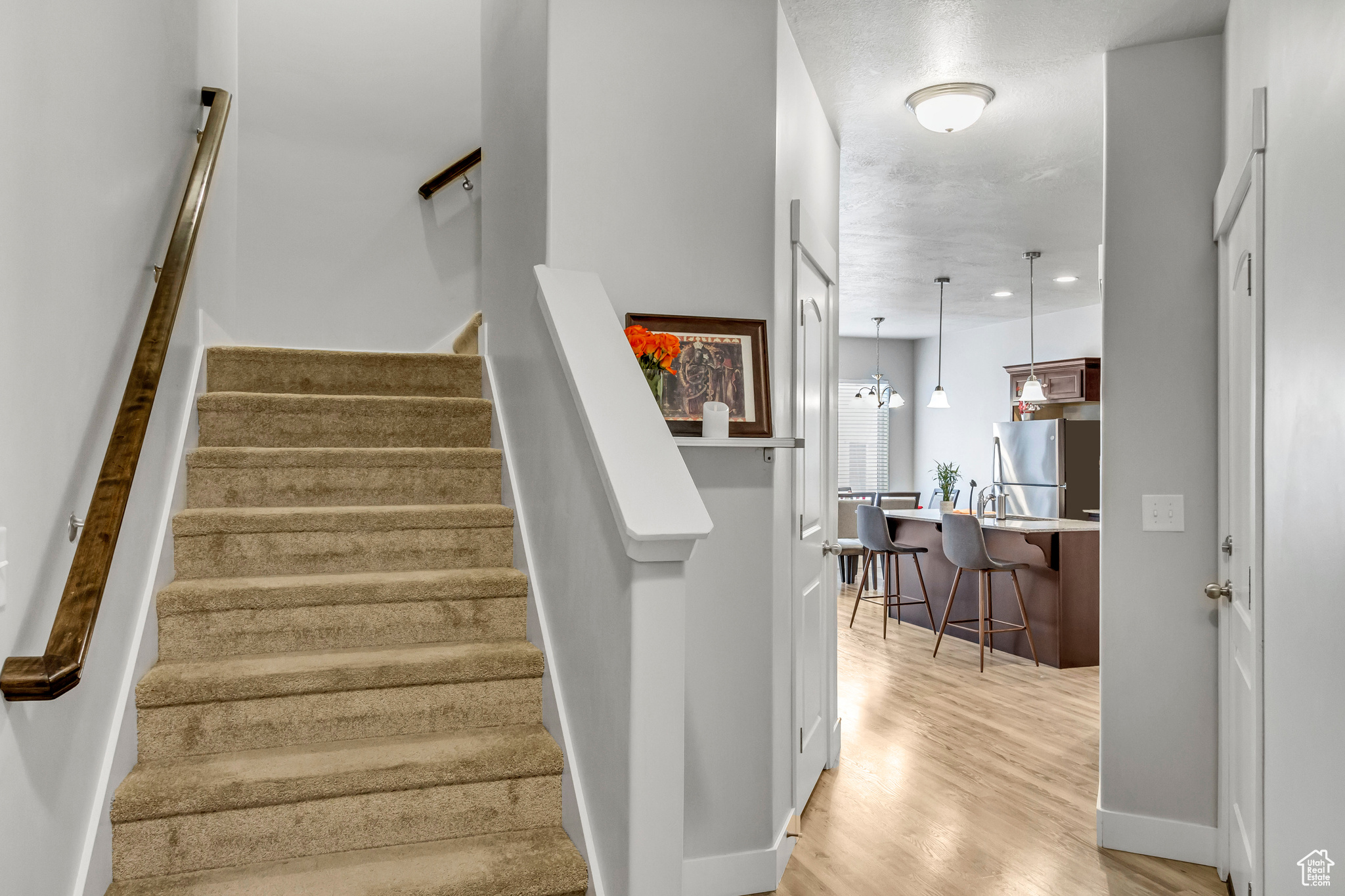 Stairs with hardwood / wood-style flooring