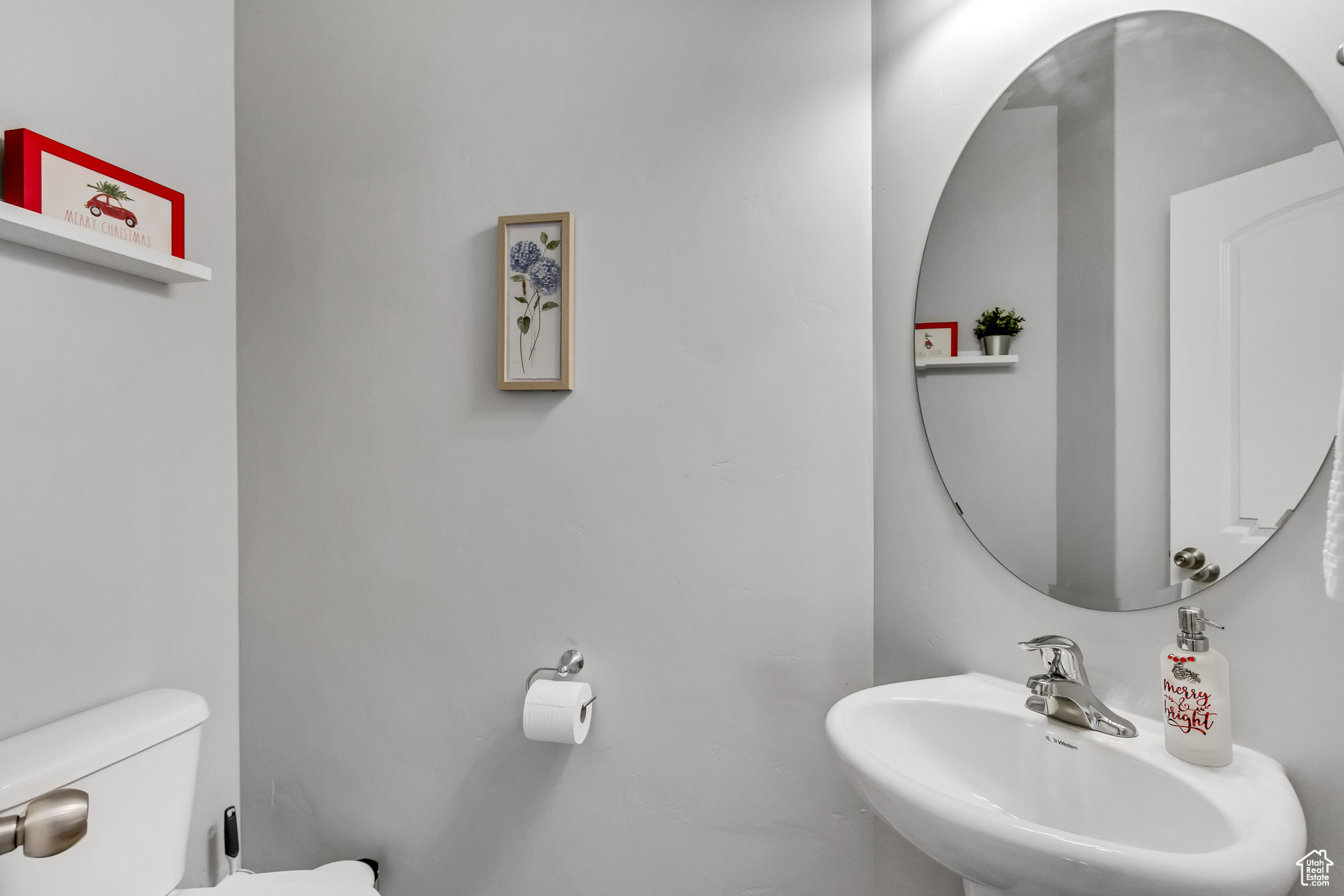 Bathroom featuring sink and toilet