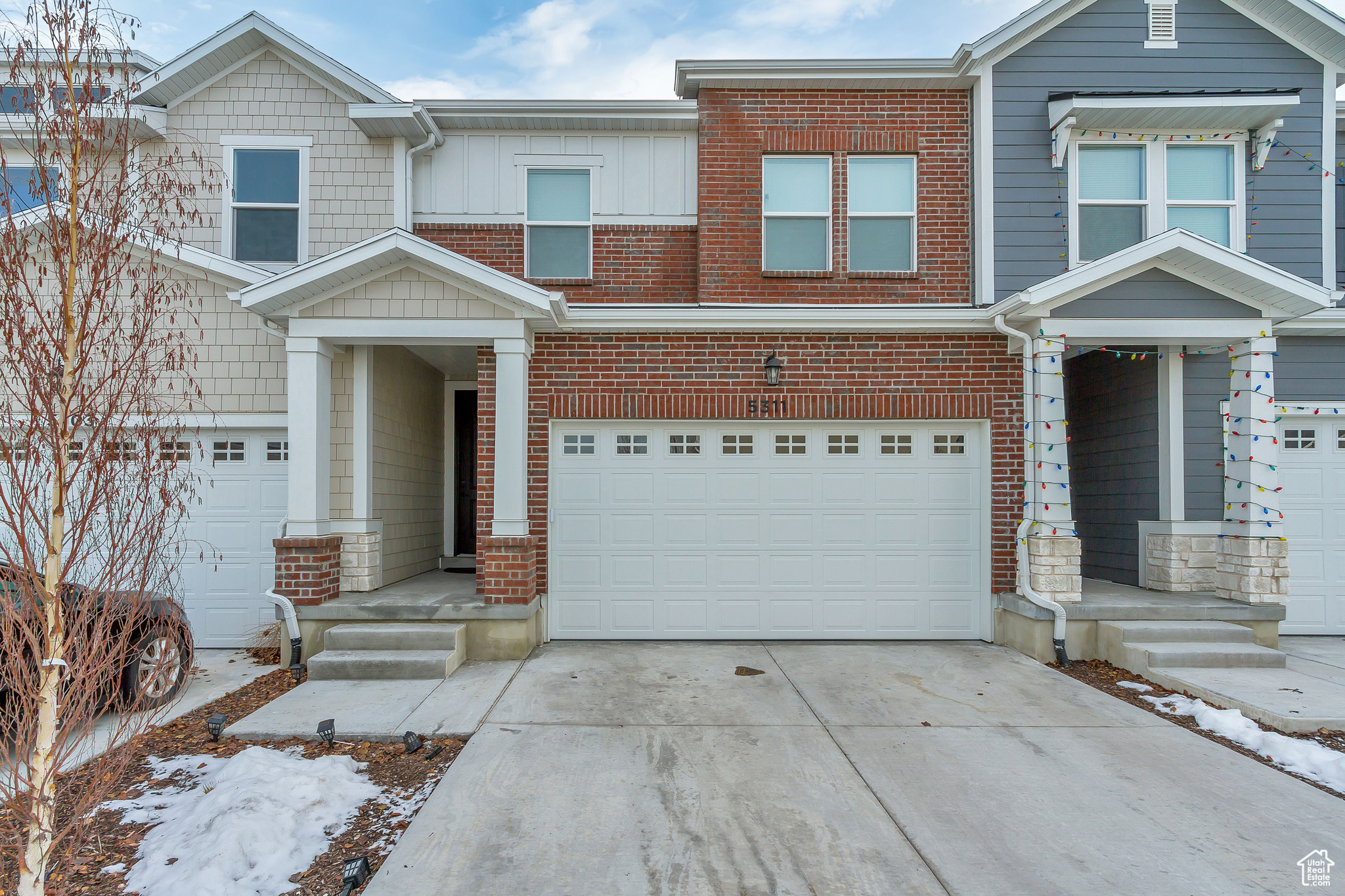 View of front facade featuring a garage