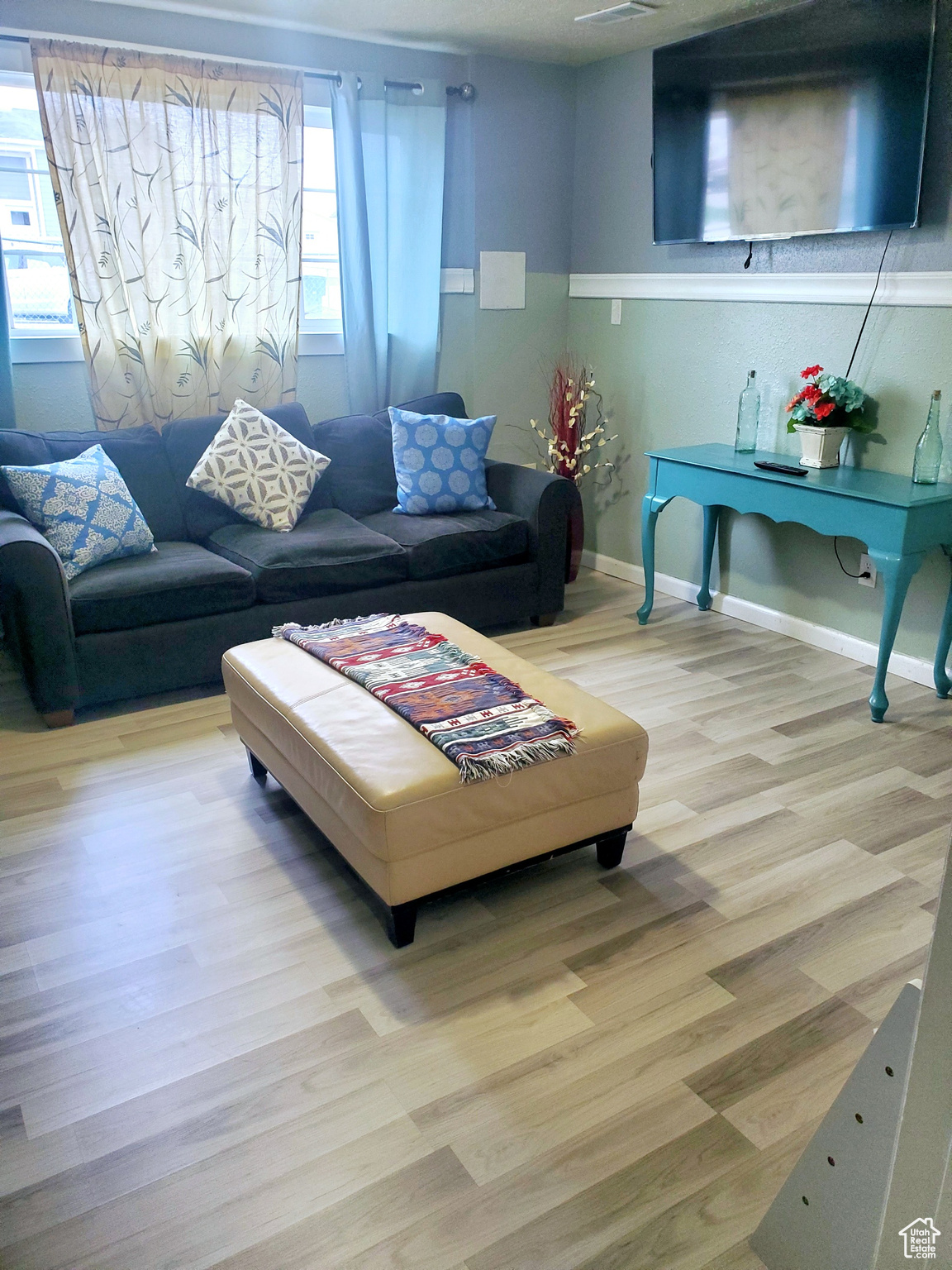 Living room with light hardwood / wood-style floors