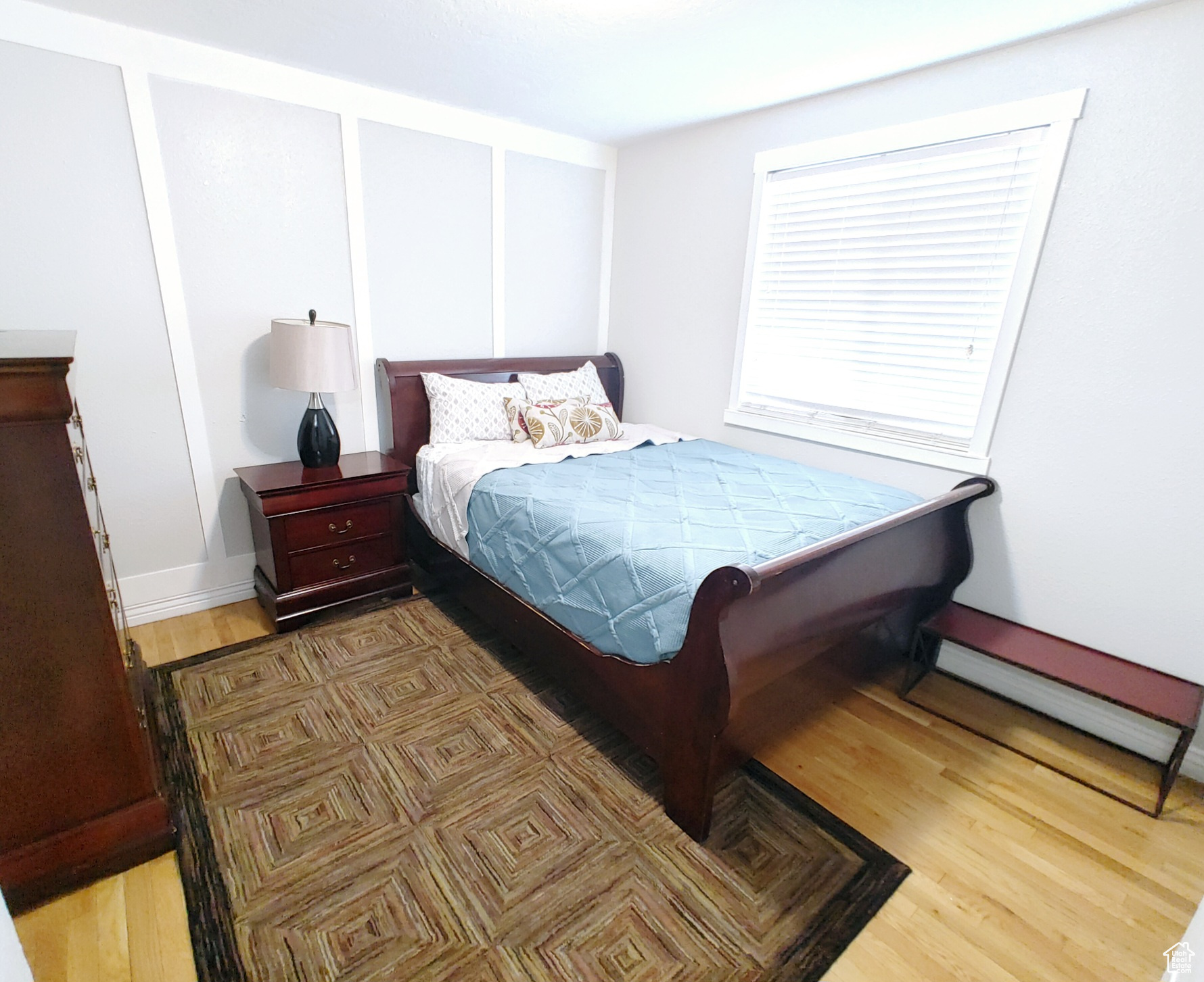 Bedroom with hardwood / wood-style floors