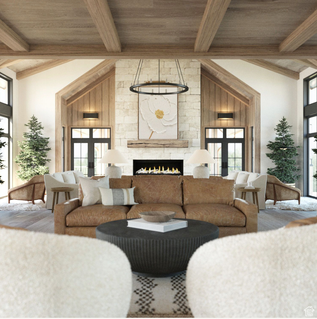 Living room with french doors, beam ceiling, wood ceiling, high vaulted ceiling, and a fireplace