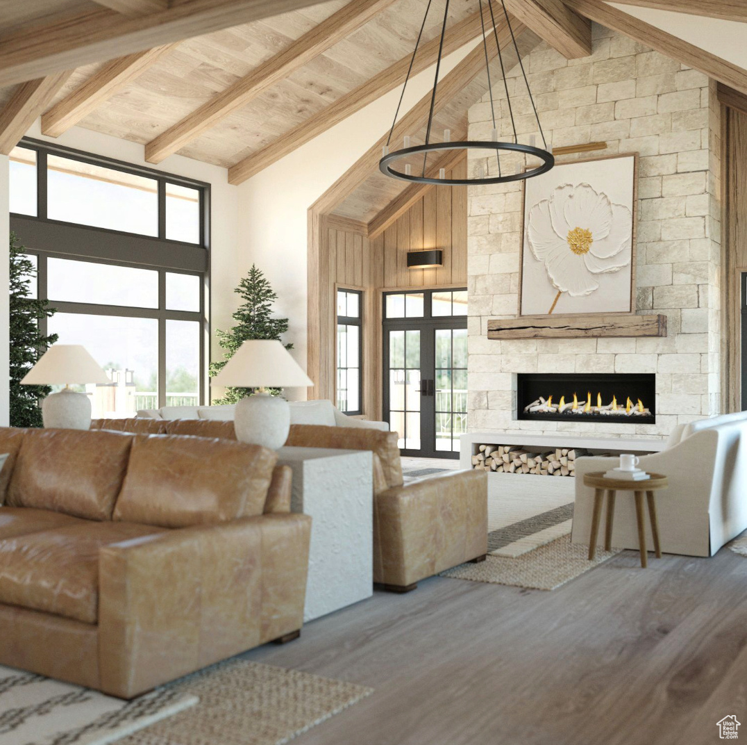 Living room featuring a wealth of natural light, high vaulted ceiling, hardwood / wood-style floors, and beam ceiling