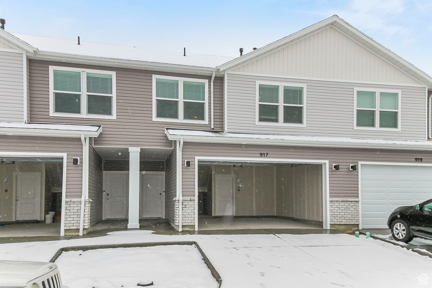 Front view of Townhome with a two-car garage