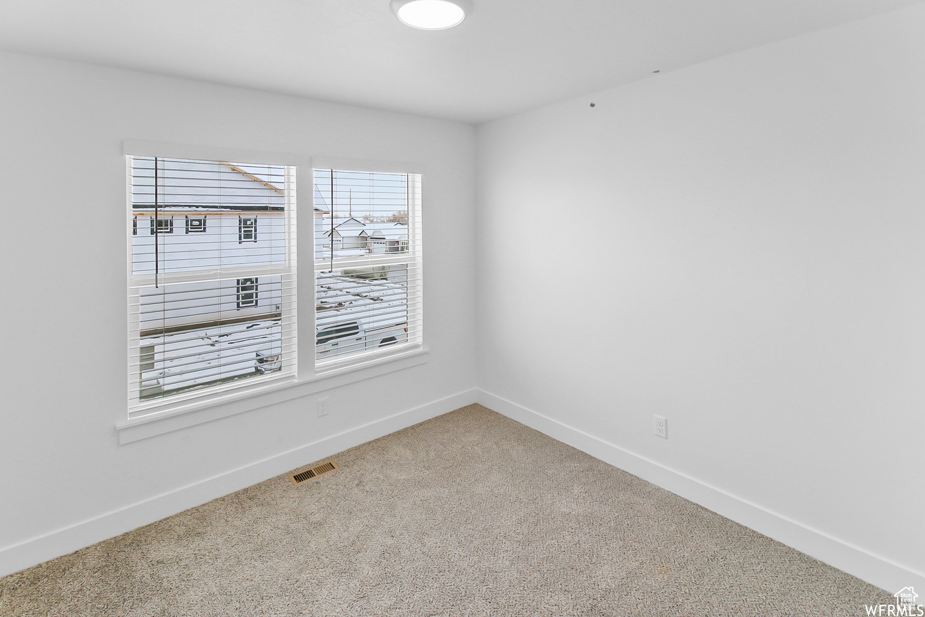 Upstairs bedroom with large windows