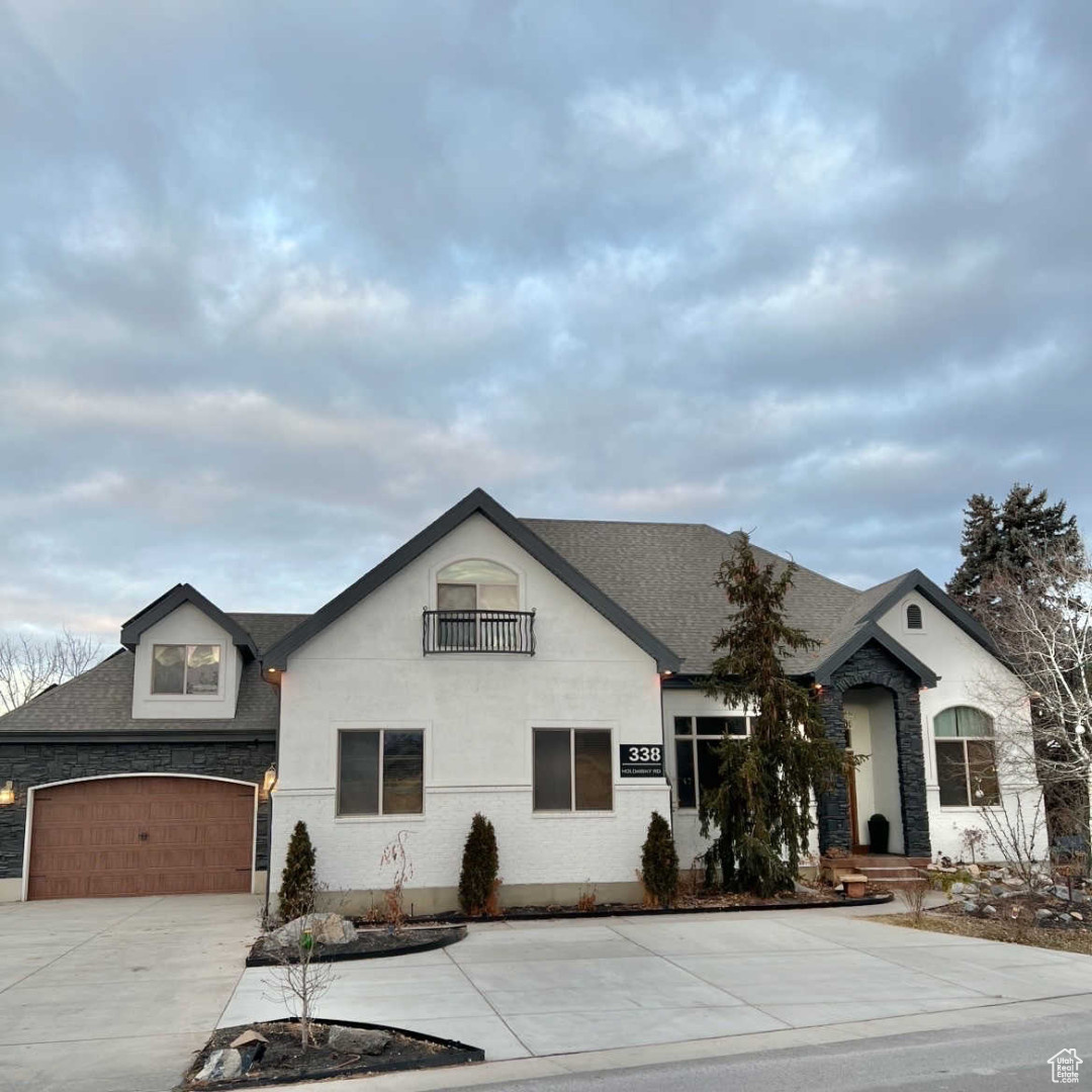 View of front facade featuring a garage