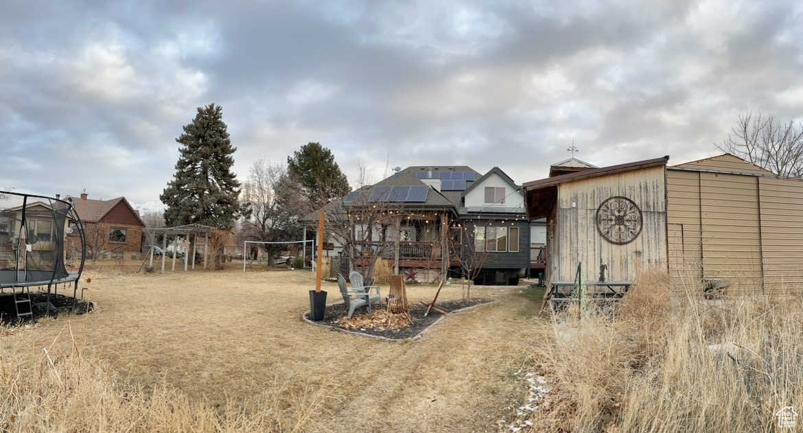 View of yard with a trampoline