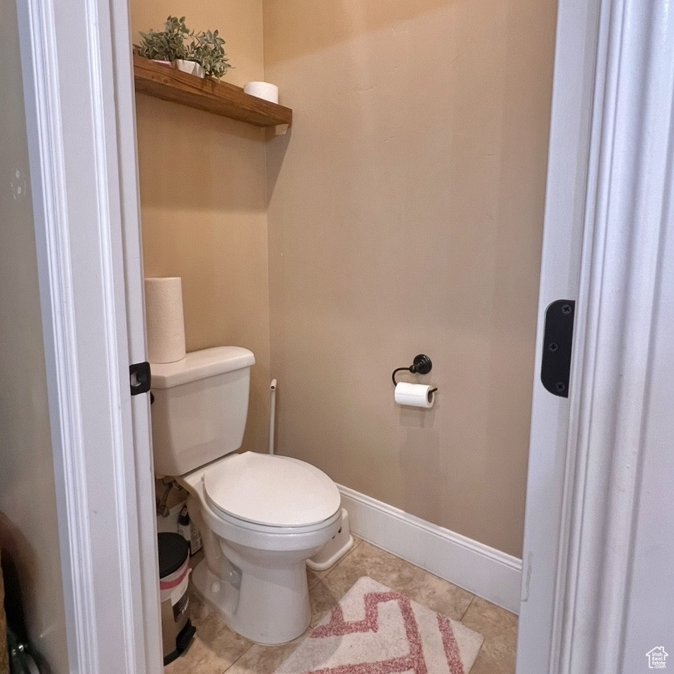 Bathroom featuring tile patterned flooring and toilet