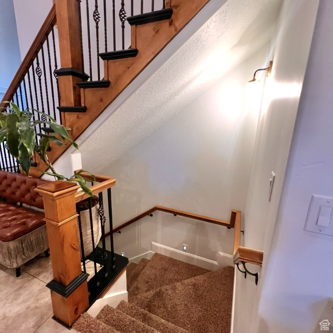 Stairway featuring tile patterned flooring