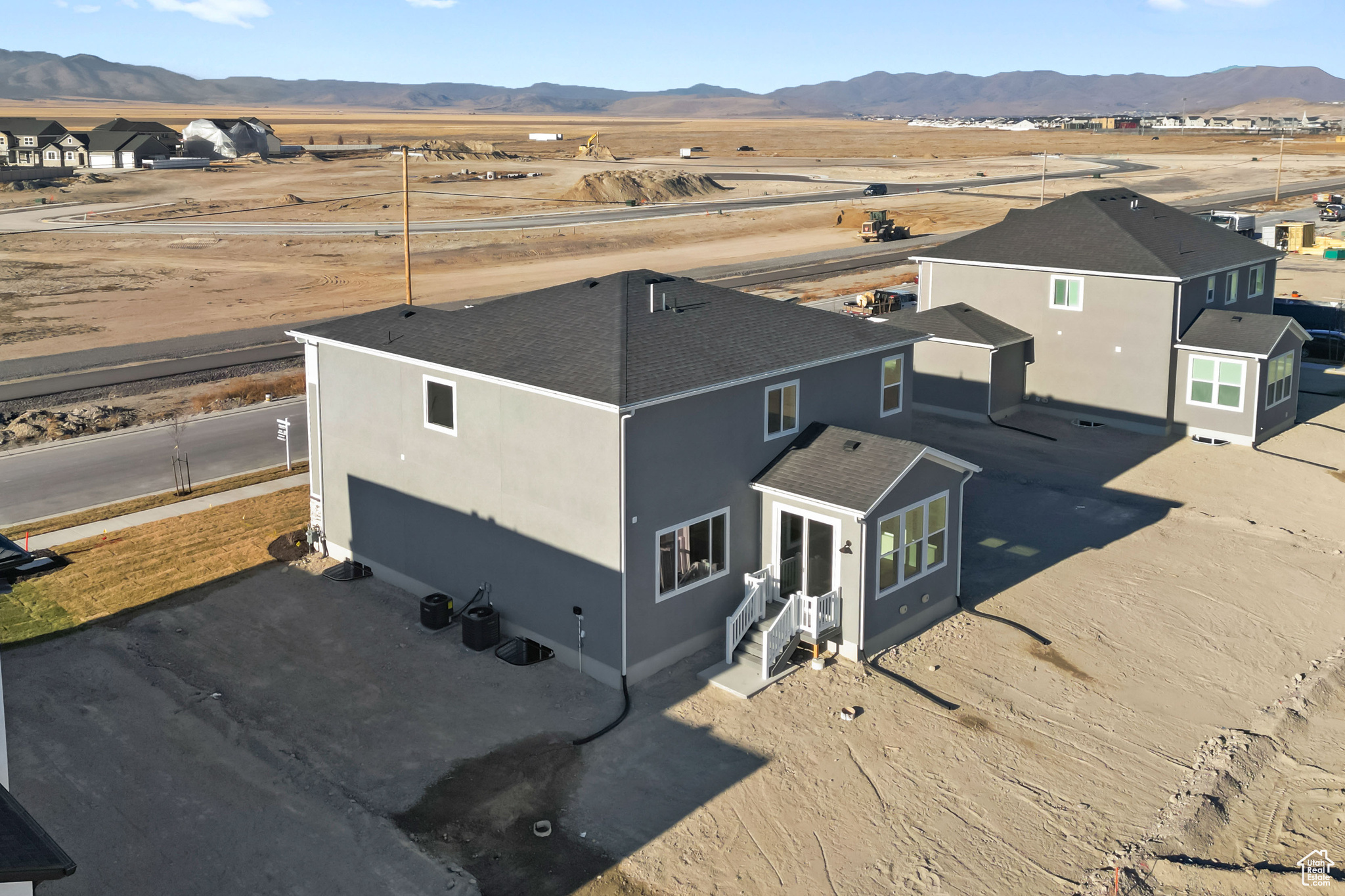 Birds eye view of property with a mountain view