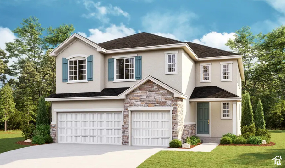 View of front of property featuring a garage and a front lawn