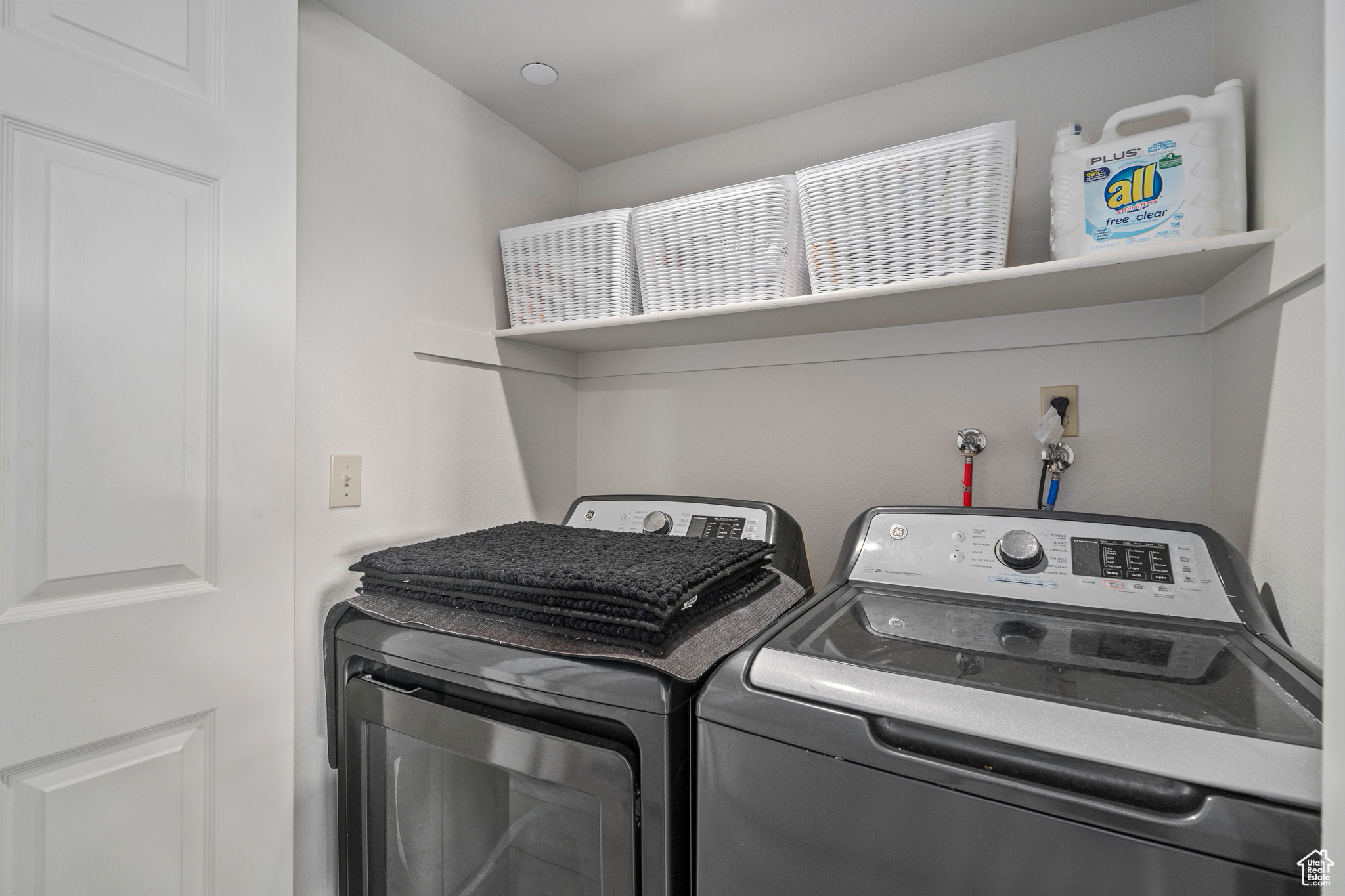 Laundry area featuring separate washer and dryer