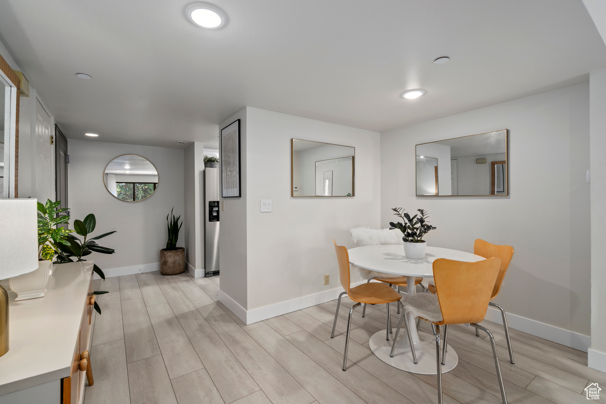 Dining area with light wood-type flooring