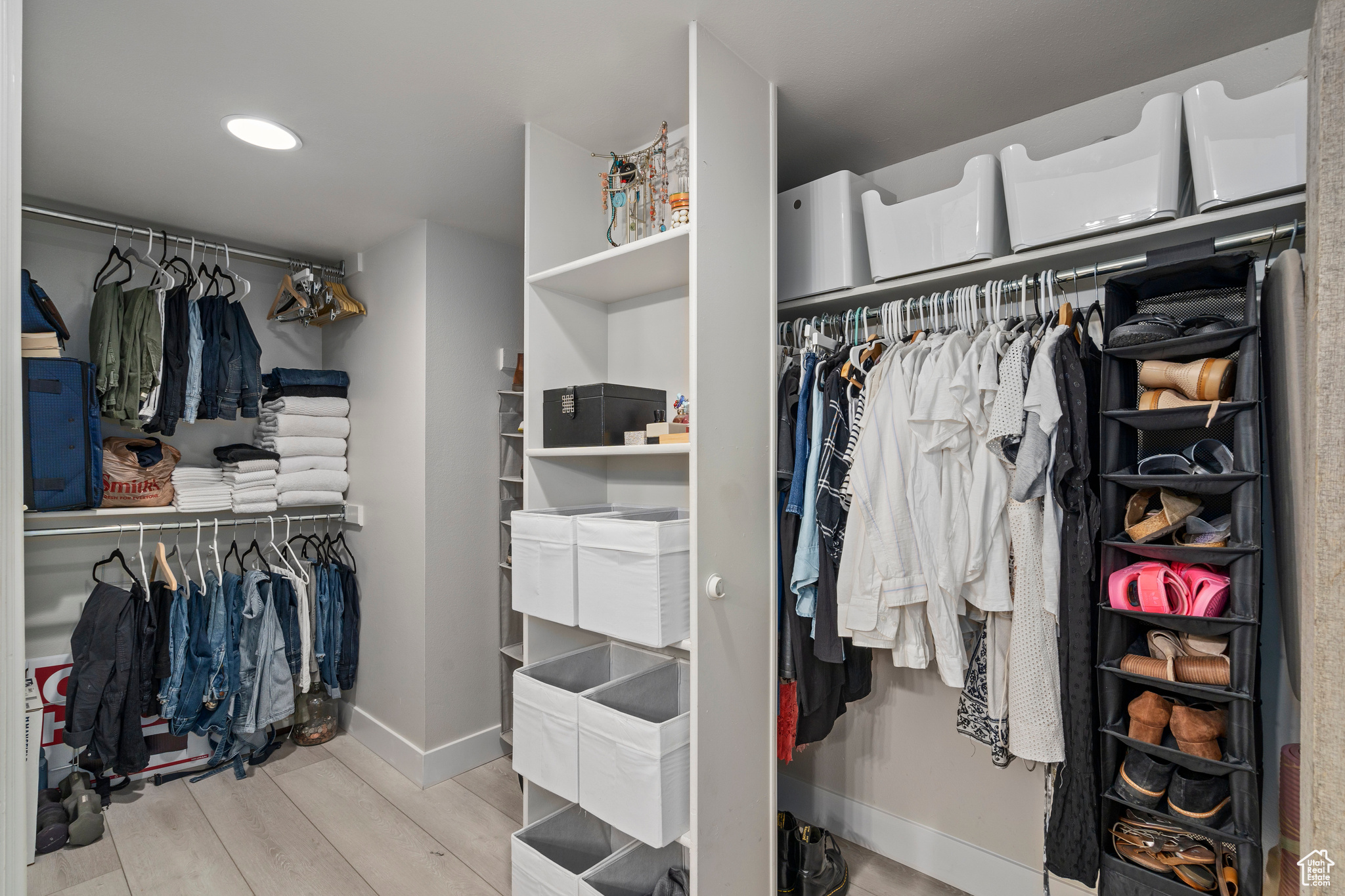 Spacious closet with light wood-type flooring