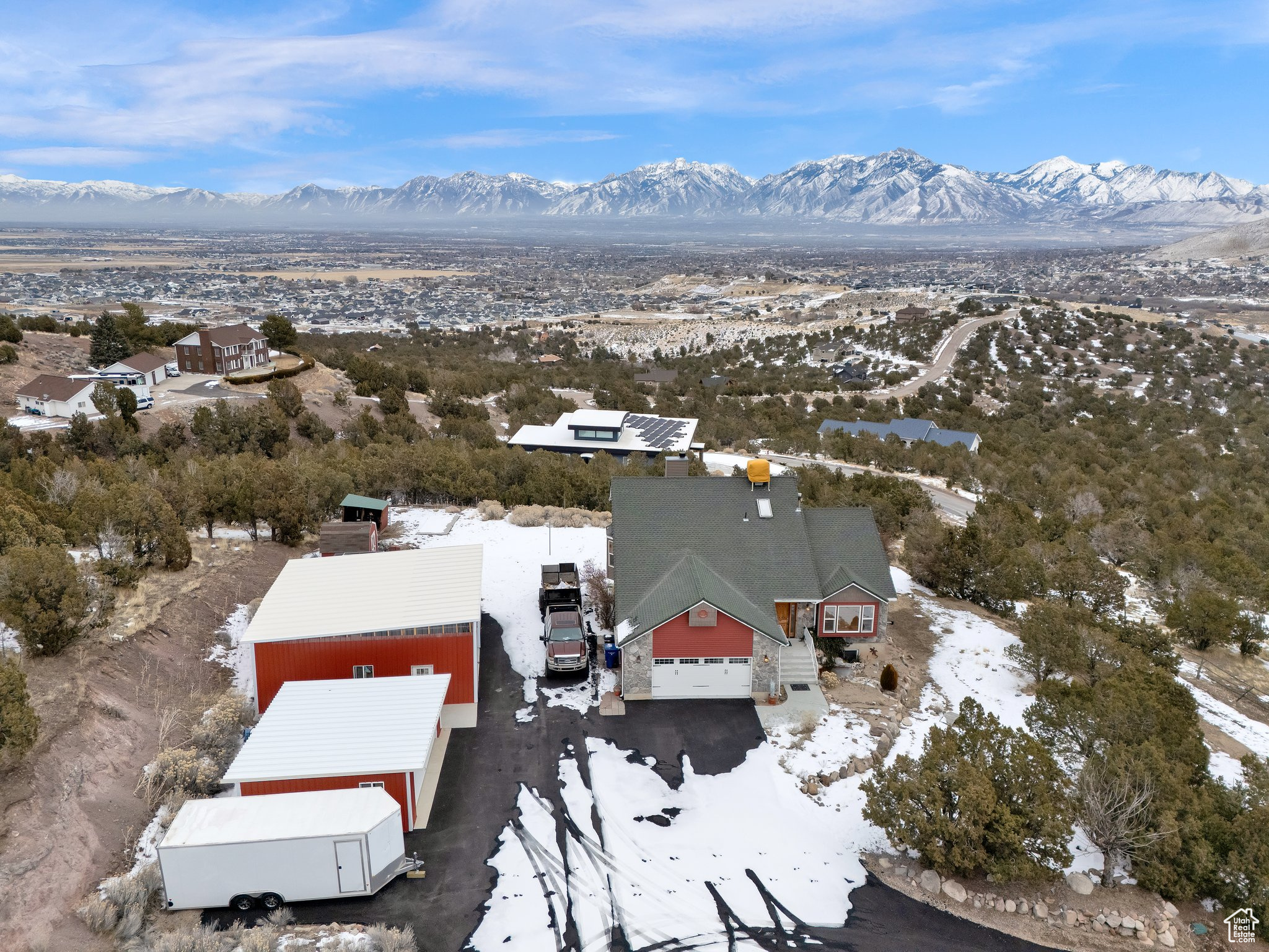 Snowy aerial view featuring a mountain view