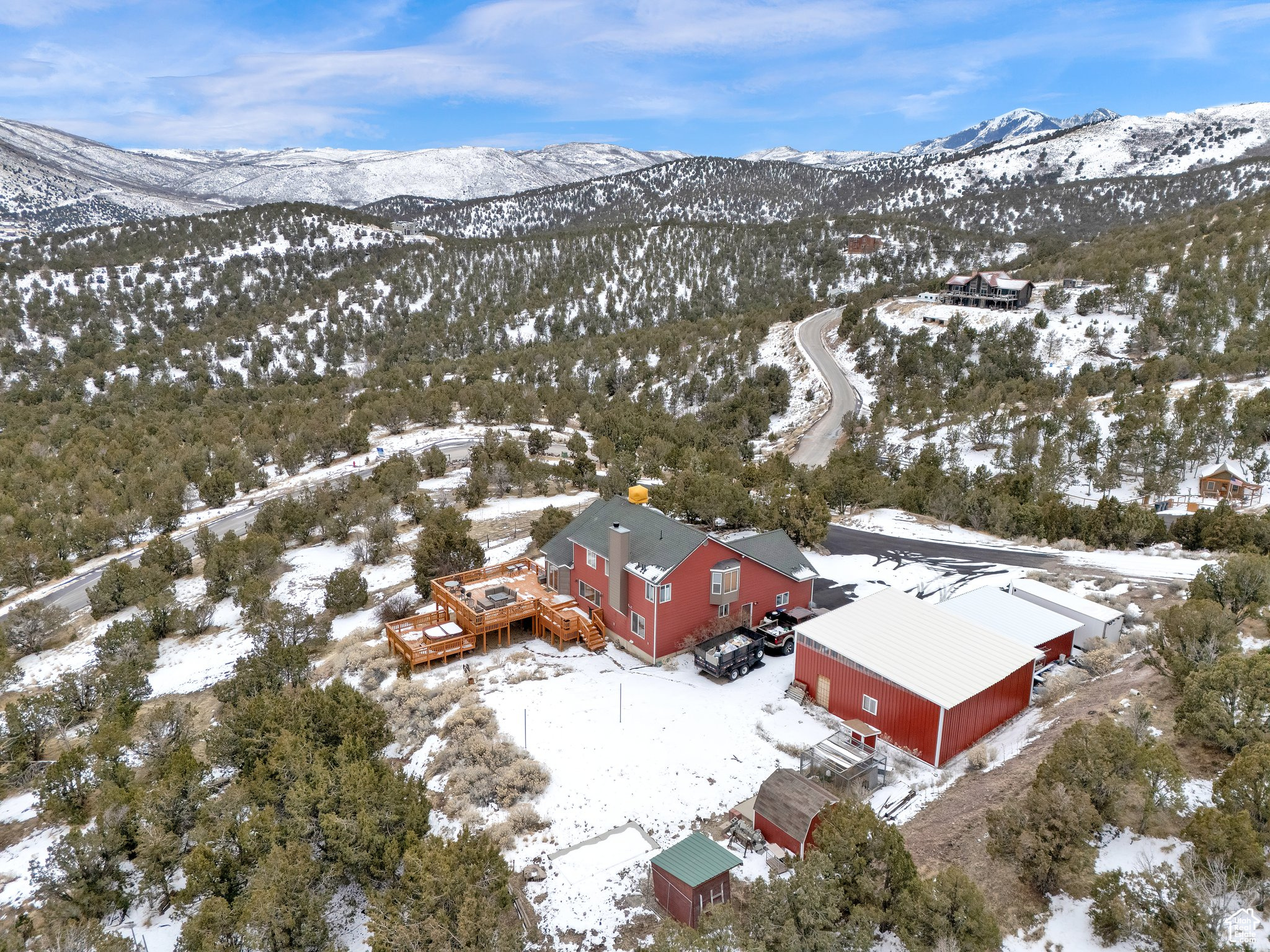 Snowy aerial view featuring a mountain view