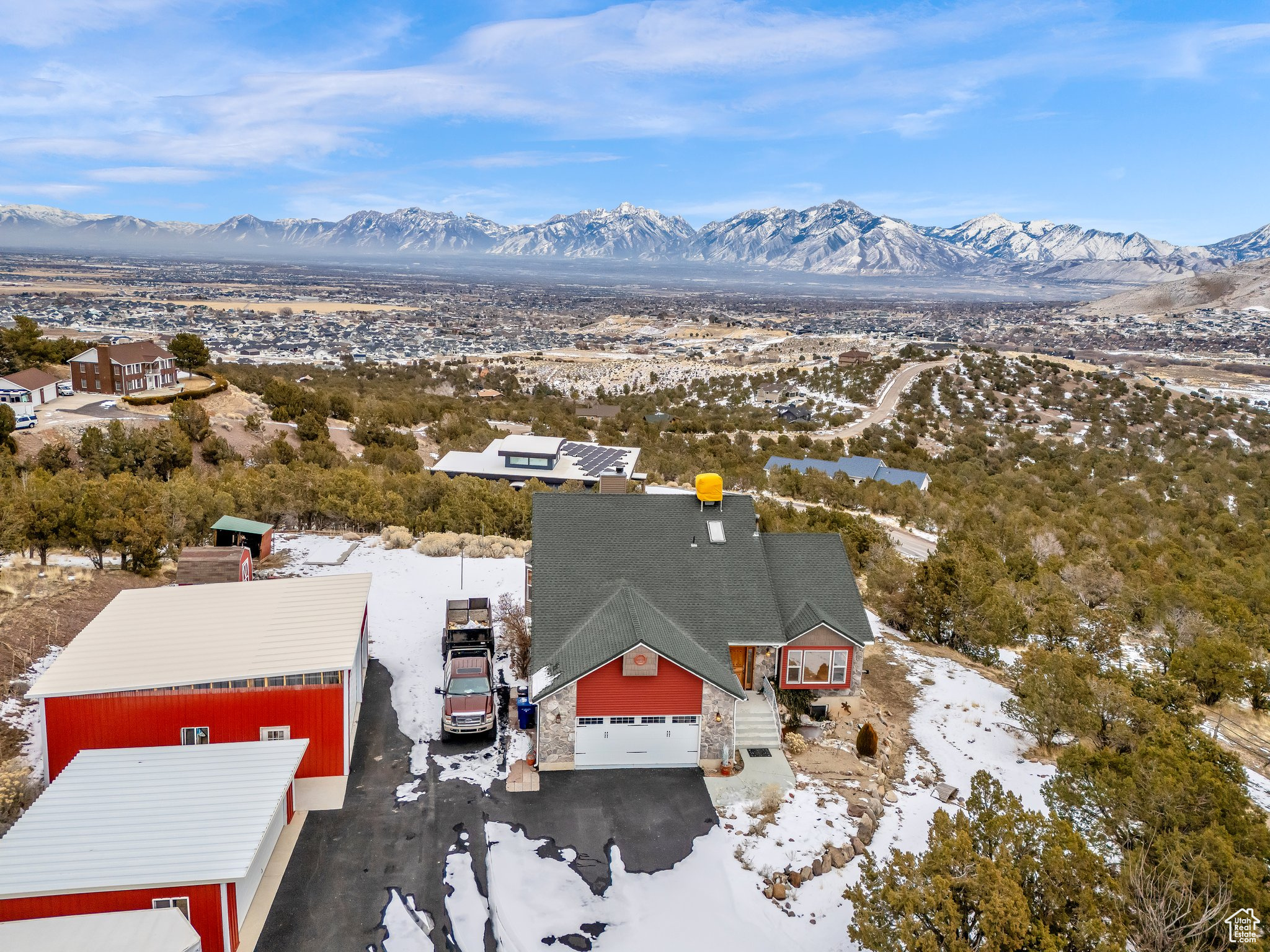 Snowy aerial view featuring a mountain view