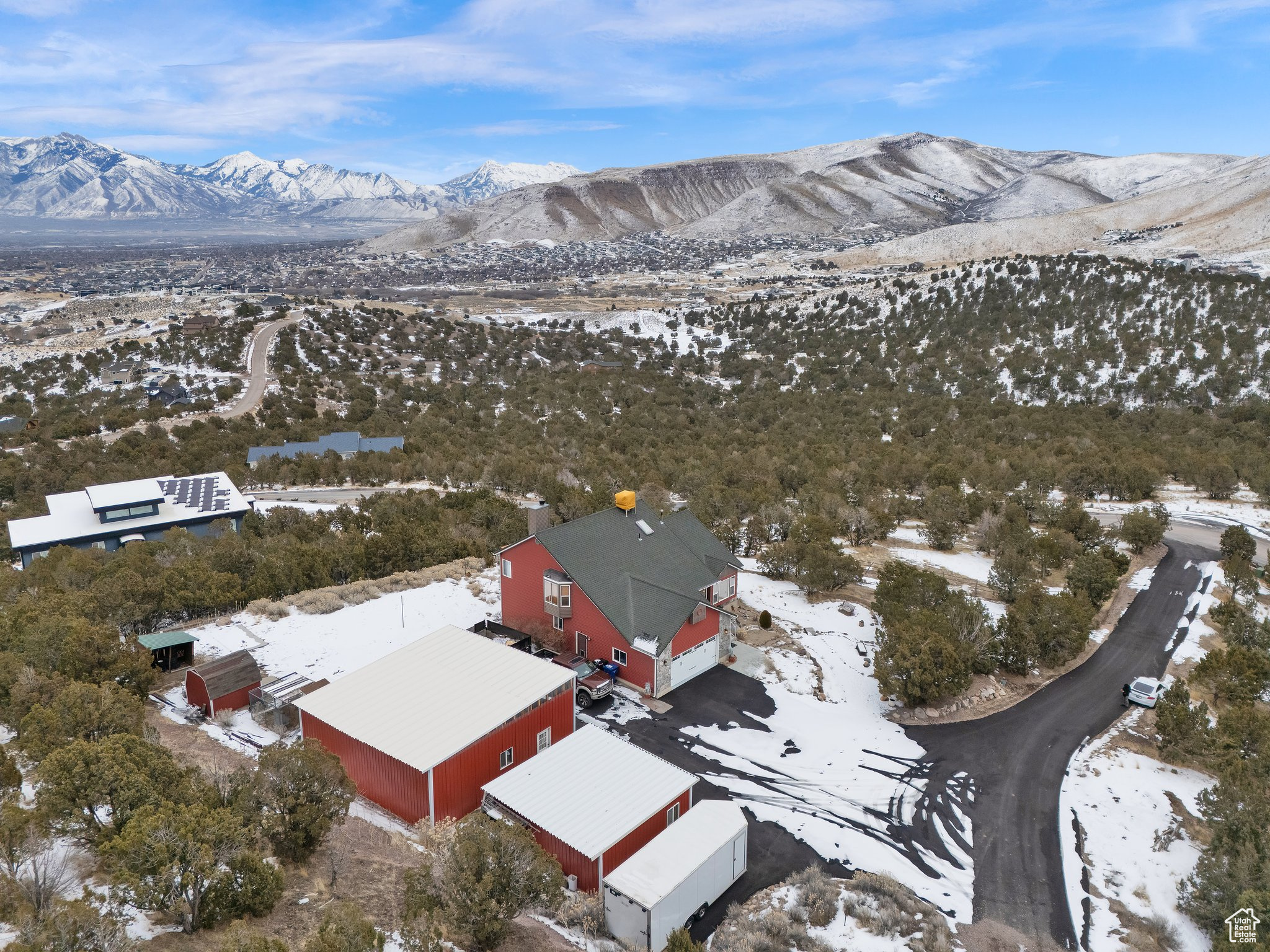 Snowy aerial view featuring a mountain view