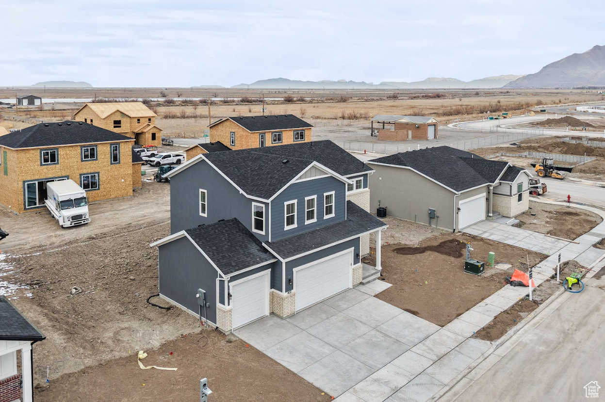 Aerial view featuring a mountain view and large lot