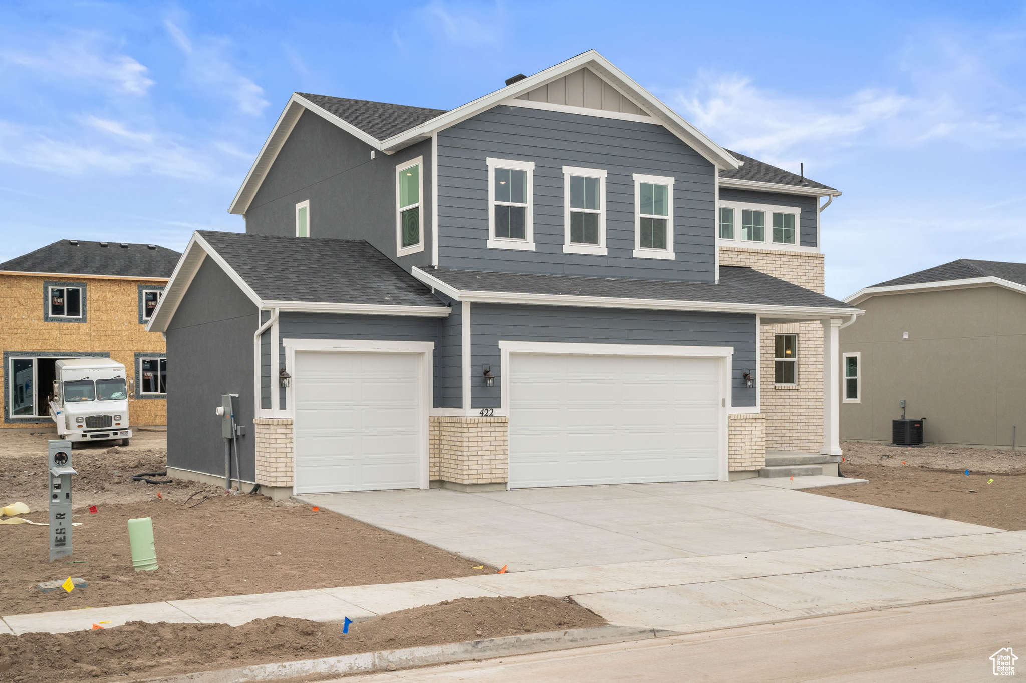 View of front of home with a 3rd car garage