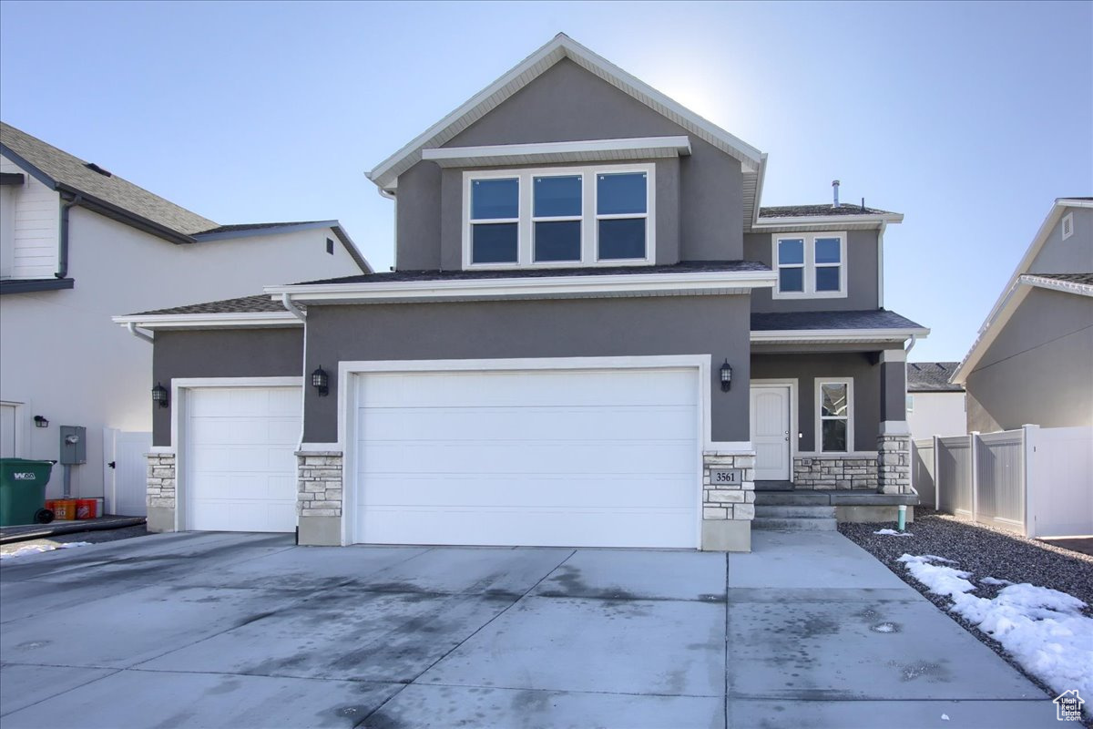 View of property with a garage