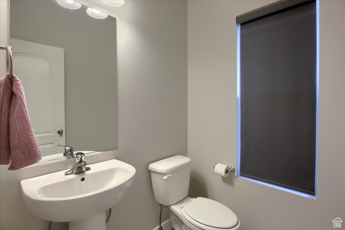 Bathroom featuring toilet and sink