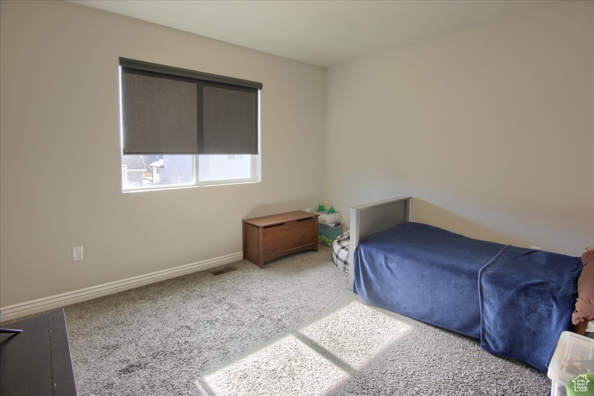 Bedroom featuring carpet