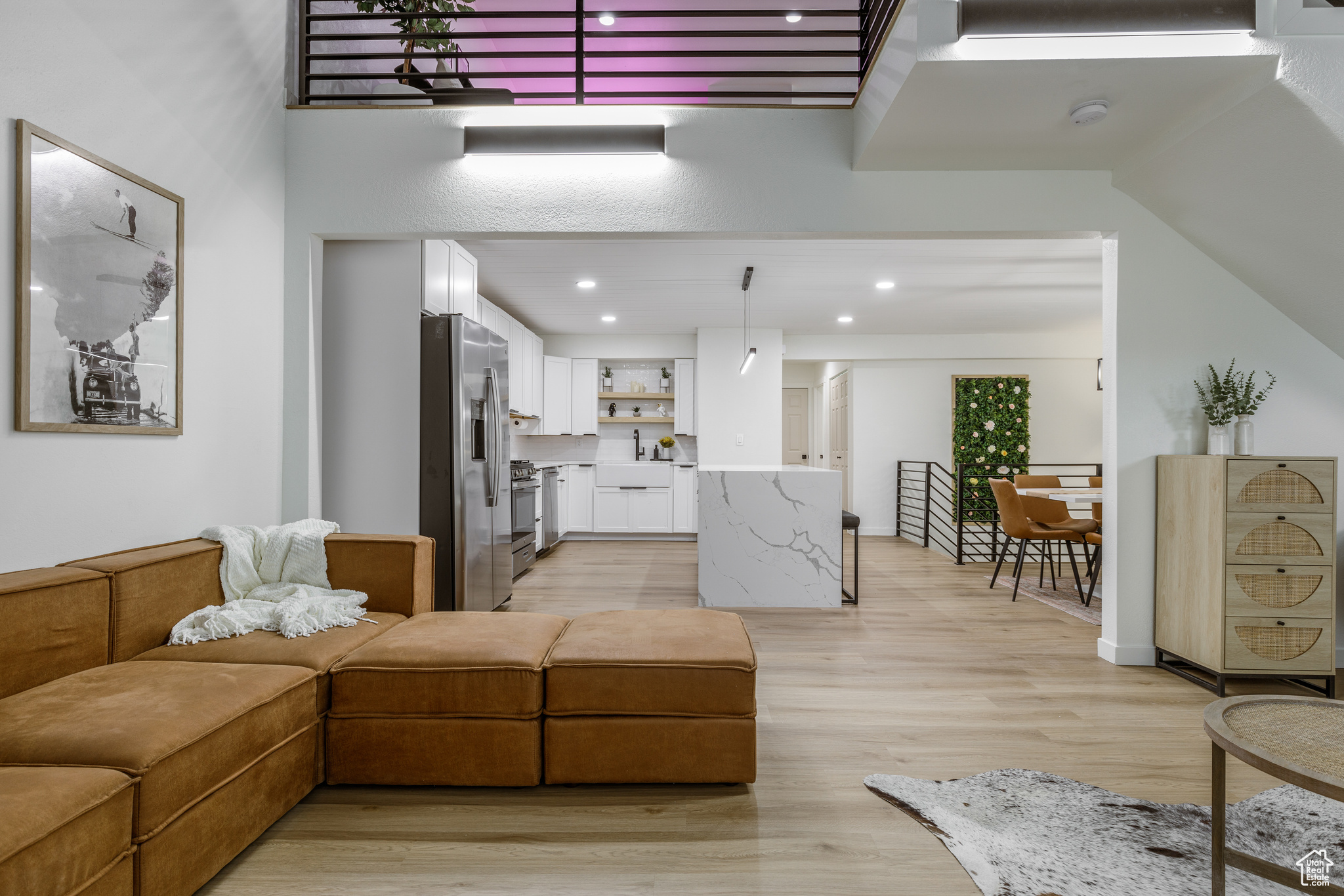 Living room featuring sink and light wood-type flooring