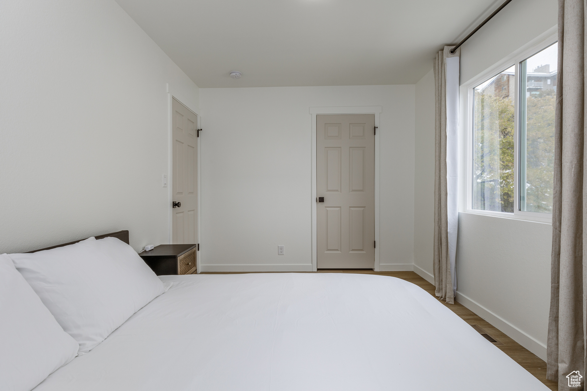 Bedroom featuring dark hardwood / wood-style flooring