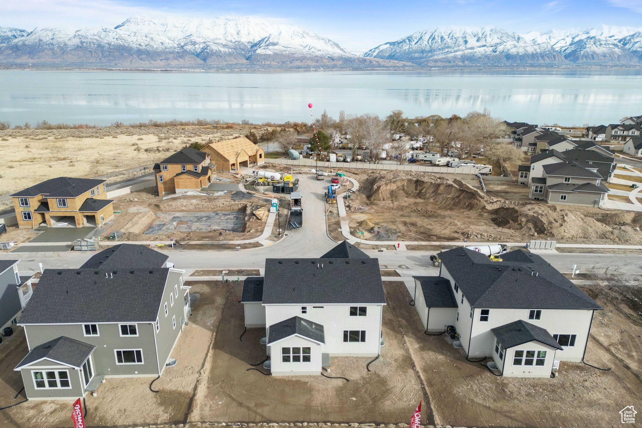 Drone / aerial view featuring a water and mountain view