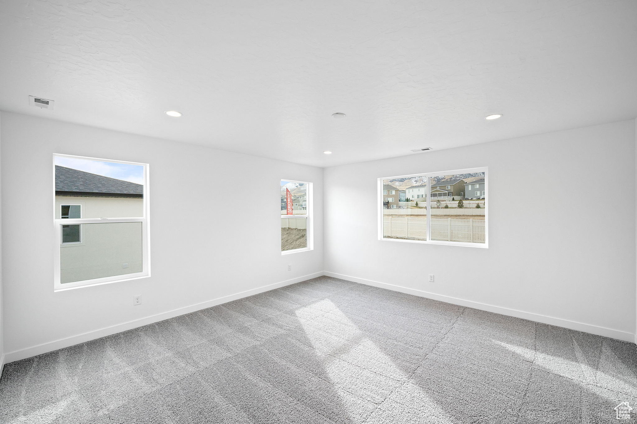 Empty room featuring carpet flooring