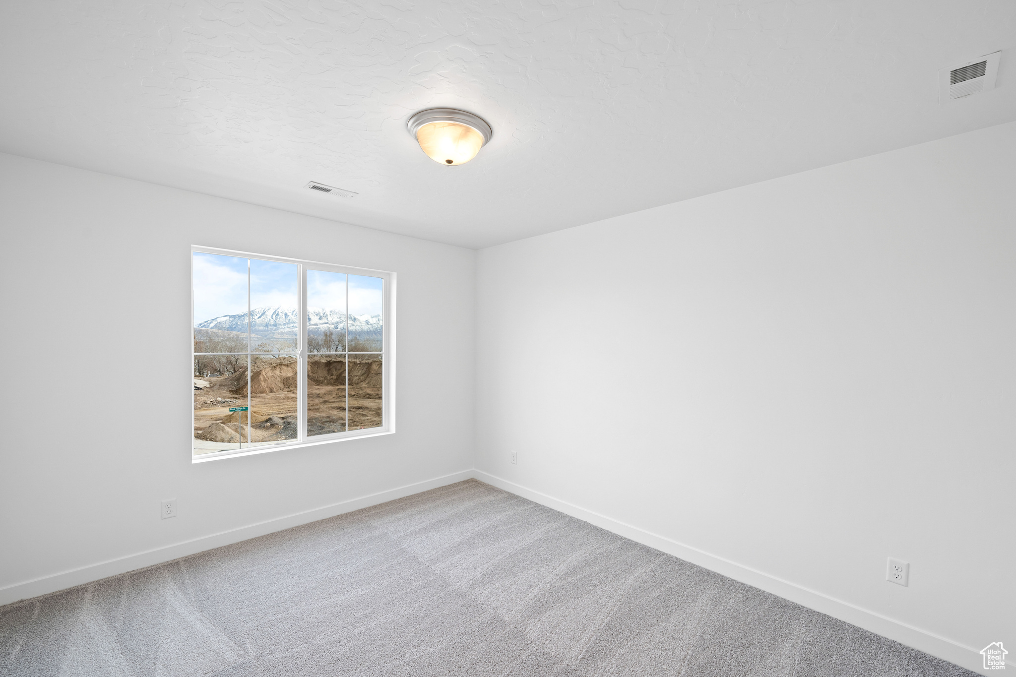 Empty room with carpet flooring