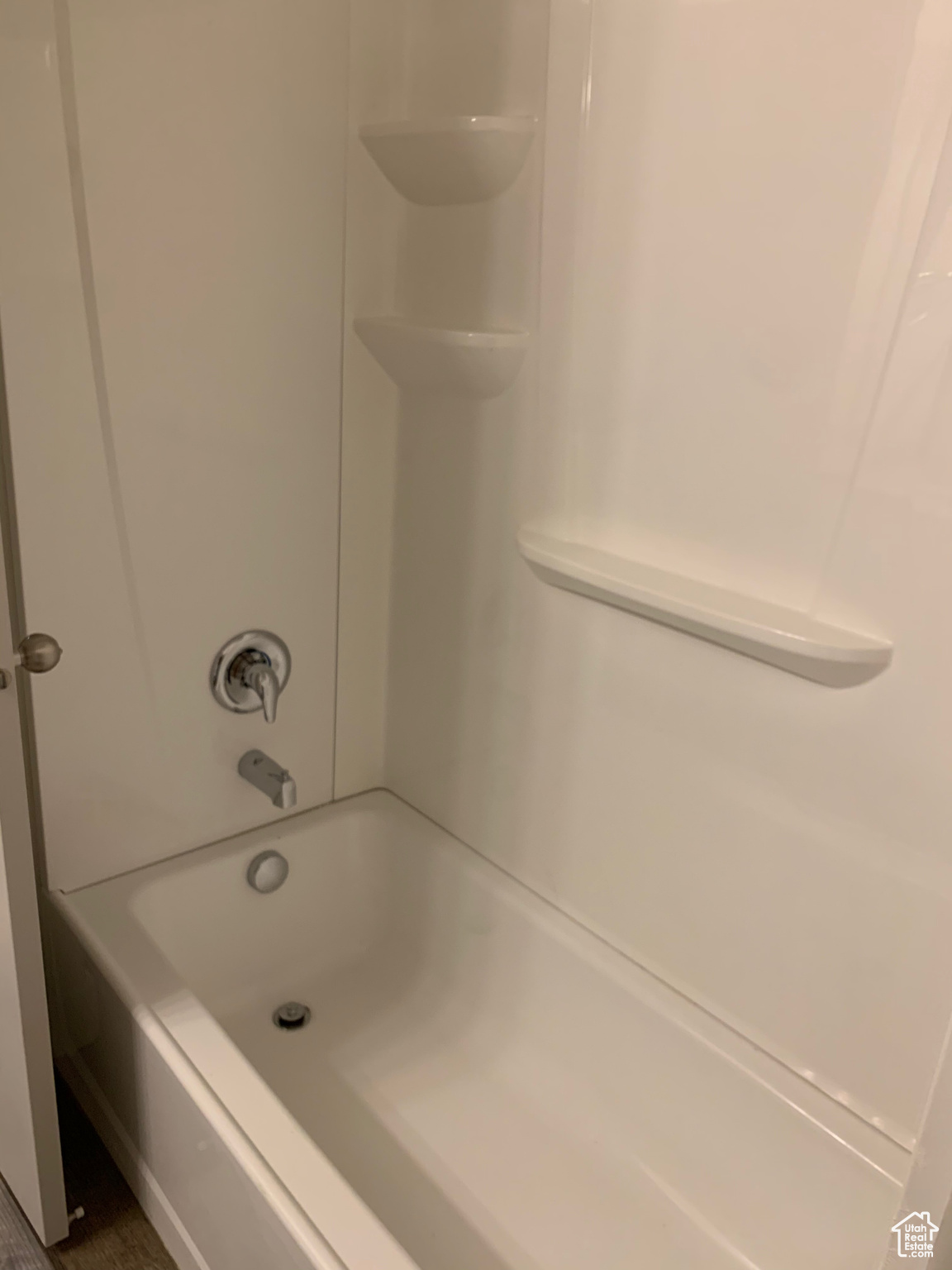 Bathroom with shower / bathing tub combination