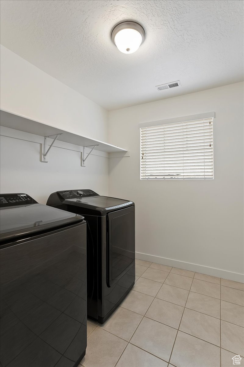 Laundry Room including washer and dryer.