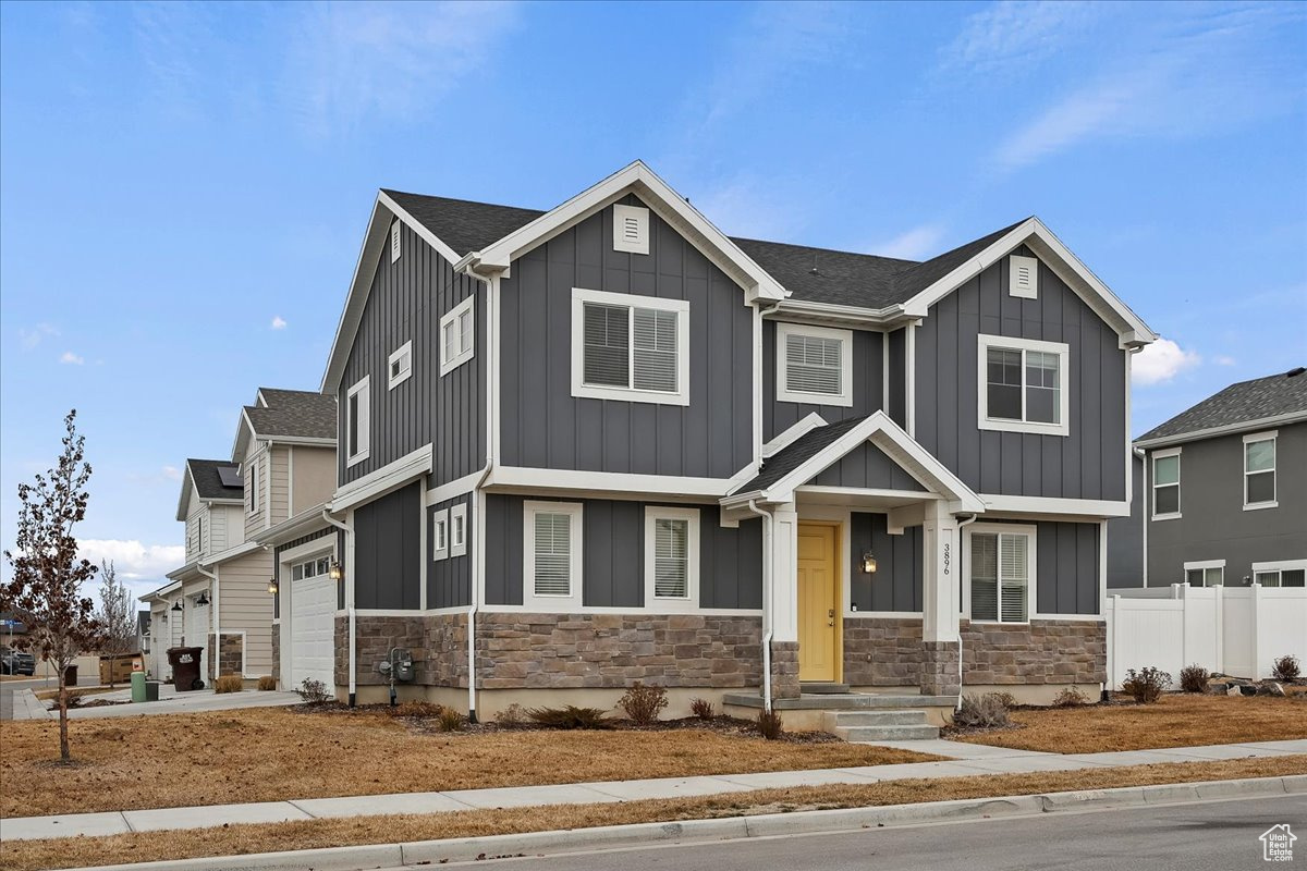 Craftsman house featuring a garage